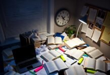 The Best Study Habits to Boost Your GPA Fast Cluttered desk with neon highlighters and melting clock