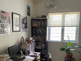 Jobs That Let You Travel the World (And Pay Well) Cluttered guesthouse desk, accidental off-kilter shot