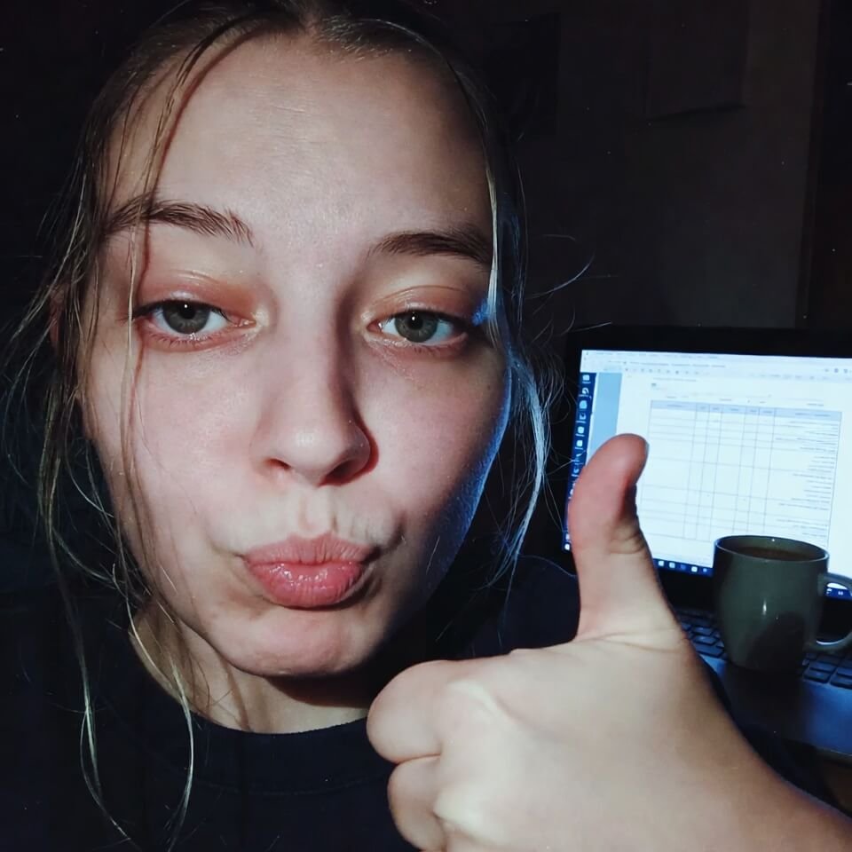 Tired thumbs-up selfie with AI study guide in background