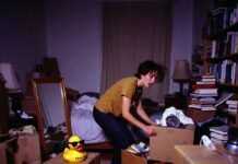 Your Ultimate Guide to Studying Abroad: Tips & Best Countries Chaotic packing mess with judgmental rubber duck wearing sunglasses.