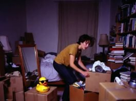 Your Ultimate Guide to Studying Abroad: Tips & Best Countries Chaotic packing mess with judgmental rubber duck wearing sunglasses.
