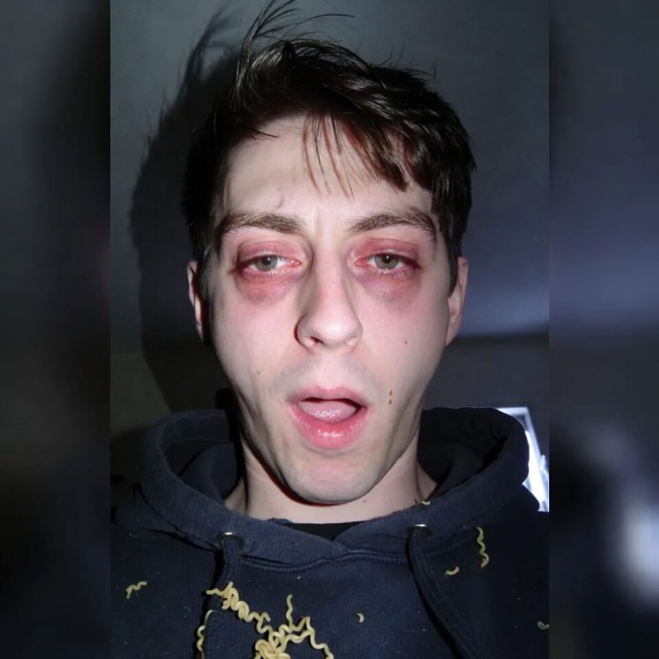 Exhausted 4:17am selfie with ramen on hoodie